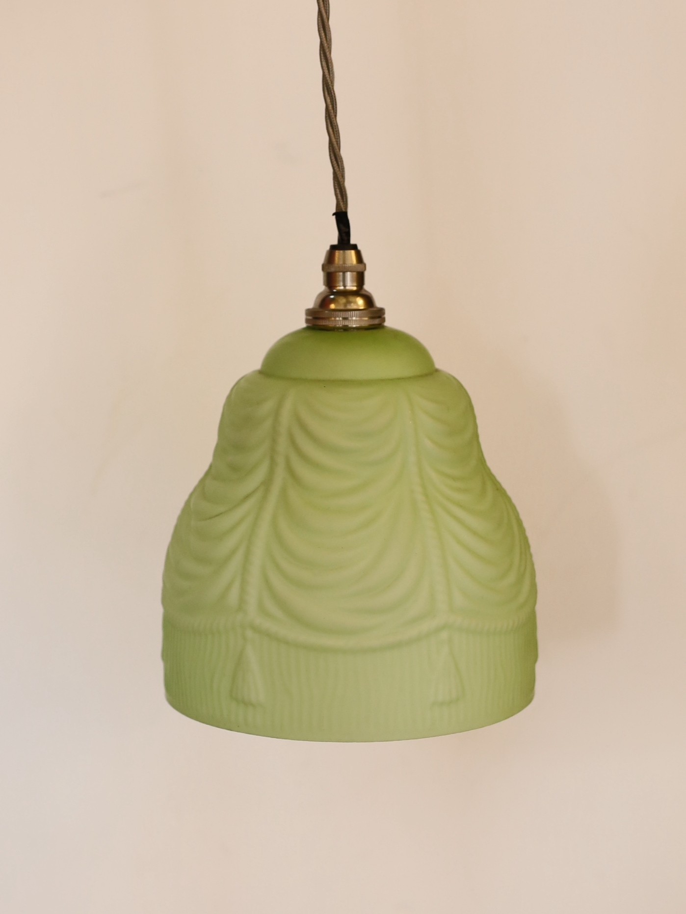 A pair of 1930s frosted green paint glass lampshades with pendant fittings, height 19cm, width 15cm